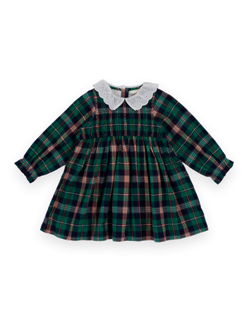 The Goldie + Ace Daphne Smocked Dress in Green Check pictured on a transparent background. The material is 100% cotton with 100% cotton lining. It is a dress made for babies, toddlers and kids.