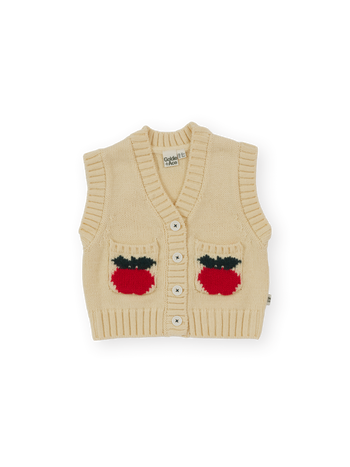 The Goldie + Ace Apple Pocket Knit Vest in Cream pictured on a transparent background. The material is 15%wool 15%nylon 70%acrylic. It is a knit made for babies, toddlers and kids.