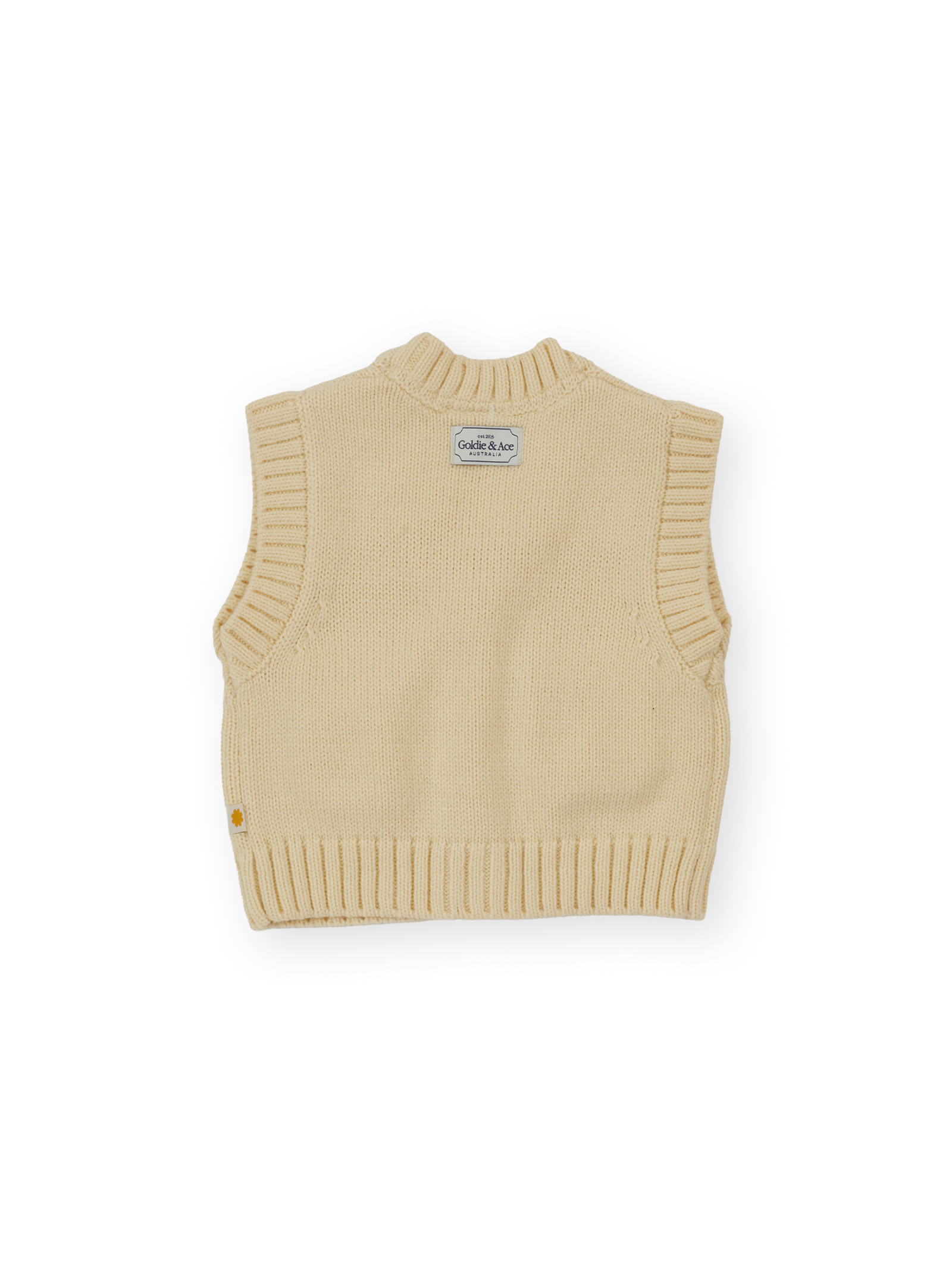 The Goldie + Ace Apple Pocket Knit Vest in Cream pictured on a transparent background. The material is 15%wool 15%nylon 70%acrylic. It is a knit made for babies, toddlers and kids.
