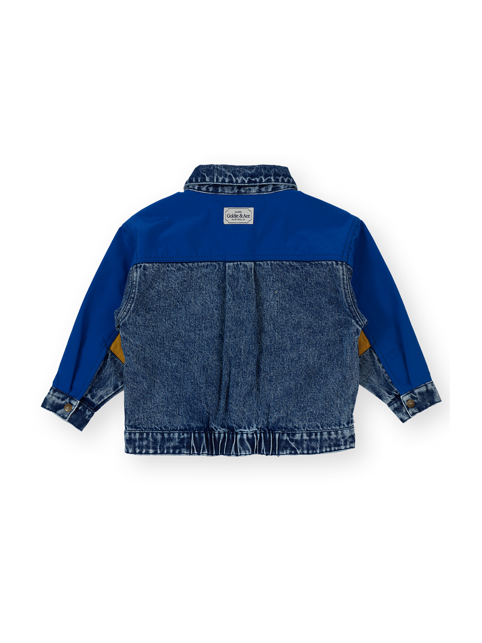 The Goldie + Ace Colour Block Vintage Denim Jacket in Dark Denim & Multi pictured on a transparent background. The material is 100% cotton, 100% polyester coloured panels, 100% cotton lining. It is a jacket made for babies, toddlers and kids.