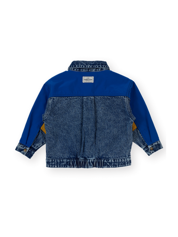 The Goldie + Ace Colour Block Vintage Denim Jacket in Dark Denim & Multi pictured on a transparent background. The material is 100% cotton, 100% polyester coloured panels, 100% cotton lining. It is a jacket made for babies, toddlers and kids.