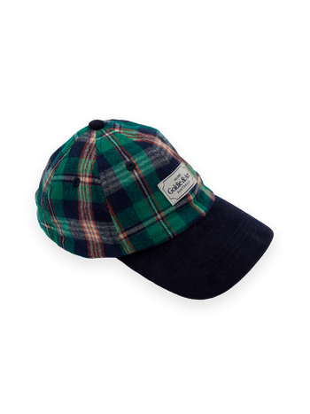 The Goldie + Ace Tate Check Cap in Green Check pictured on a transparent background. The material is 100% cotton with 100% cotton lining. It is a hat made for babies, toddlers and kids.