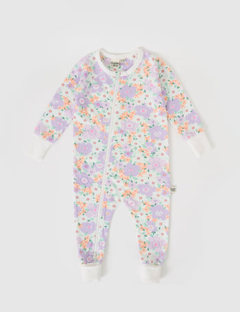 The Goldie + Ace Flora Zipsuit in Lilac Multi pictured on a grey background. The material is soft cotton elastane. It is a babywear made for babies, toddlers and kids.