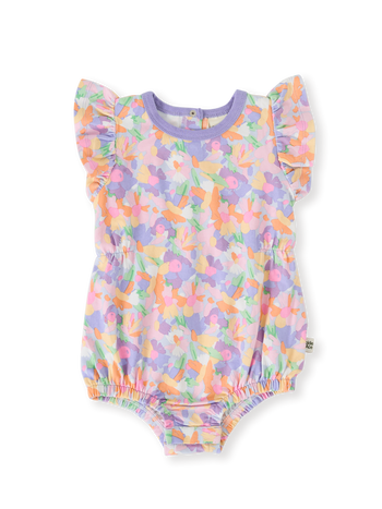 The Goldie + Ace Pastel Bouquet Frill Bubble Romper in Lilac Multi pictured on a transparent background. The material is soft cotton elastane. It is a romper made for babies, toddlers and kids.