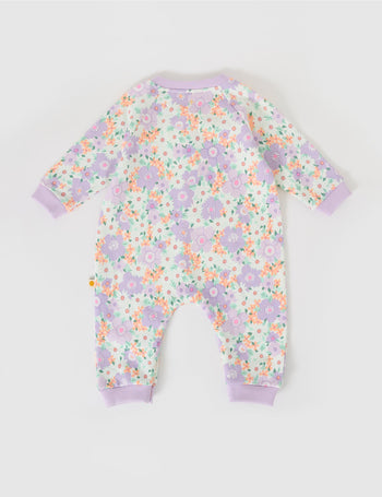 The Goldie + Ace Flora Relaxed Terry Romper in Lilac Multi pictured on a grey background. The material is cotton terry. It is a babywear made for babies, toddlers and kids.