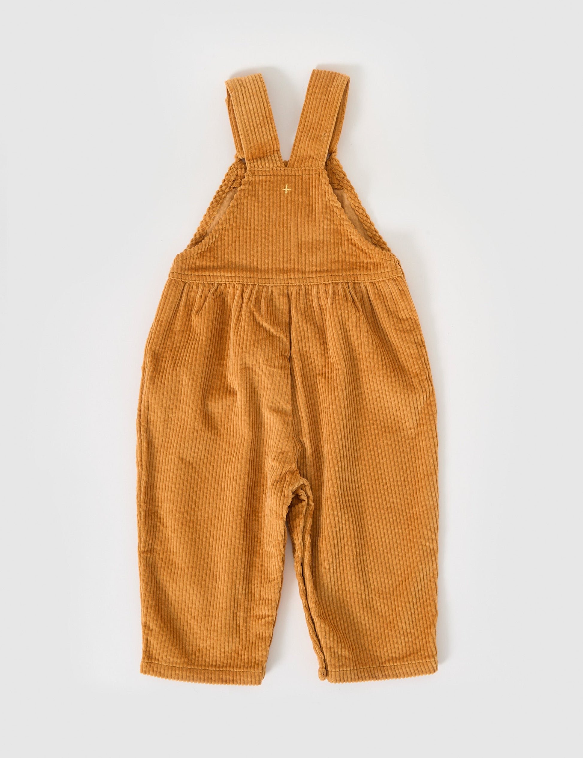 The Goldie + Ace Sammy Corduroy Overalls in Golden pictured on a grey background. The material is cotton cord. It is a overall made for babies, toddlers and kids.