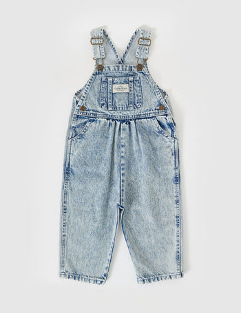 The Goldie + Ace Austin Vintage Washed Denim Overalls in Light Denim pictured on a grey background. The material is cotton denim. It is a overall made for babies, toddlers and kids.