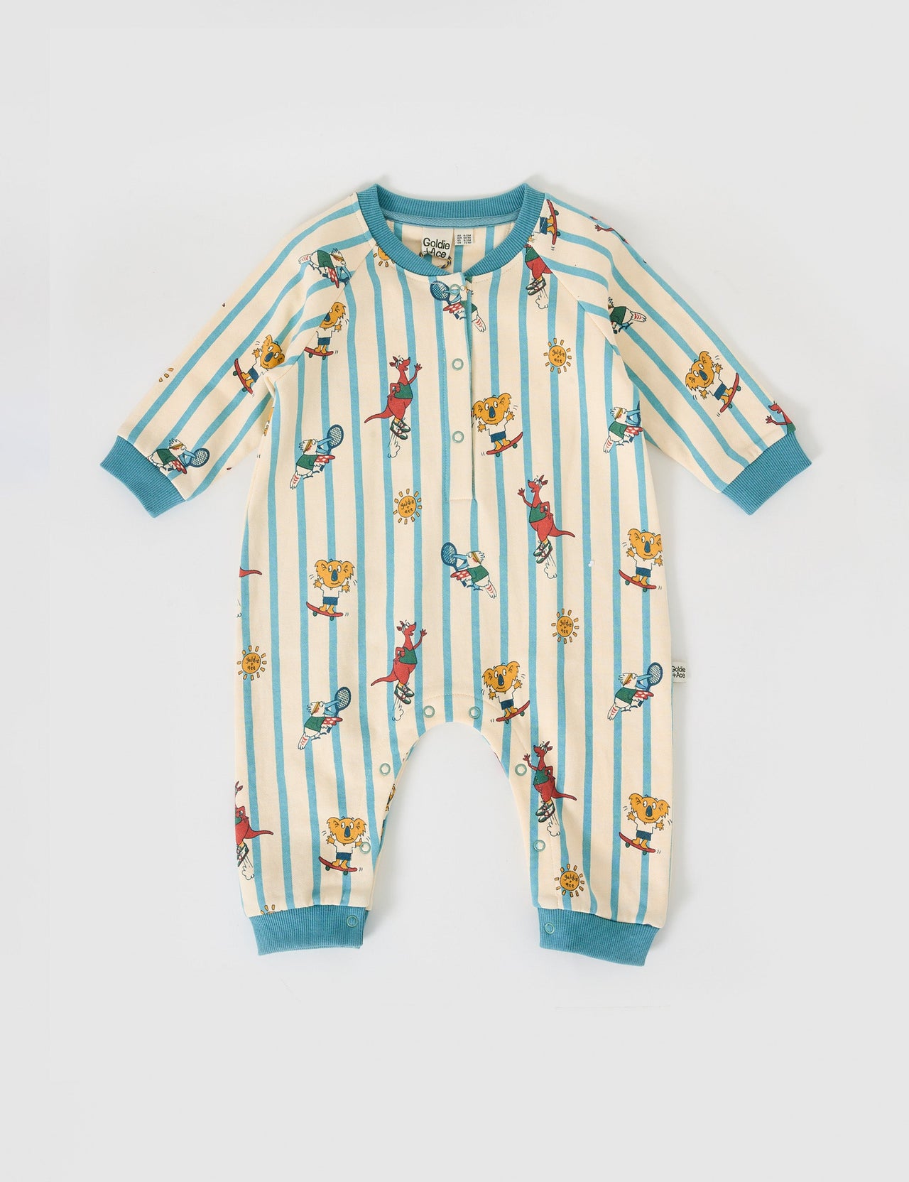 The Goldie + Ace Goldie Squad Relaxed Terry Romper in Vanilla/Dusty Blue pictured on a grey background. The material is cotton terry. It is a babywear made for babies, toddlers and kids.