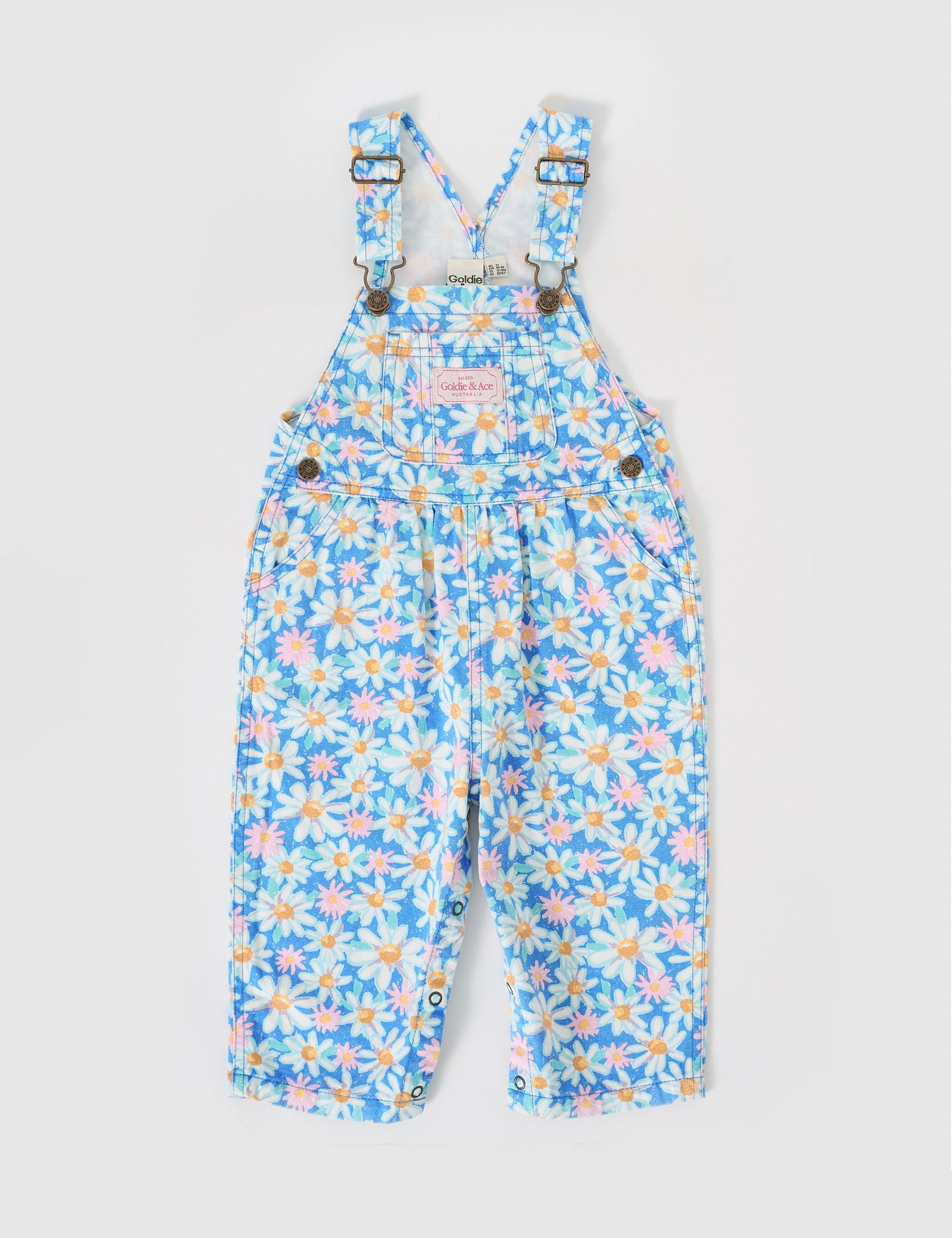 The Goldie + Ace Austin Overalls in Seaside Daisy pictured on a grey background. The material is cotton terry. It is a overall made for babies, toddlers and kids.