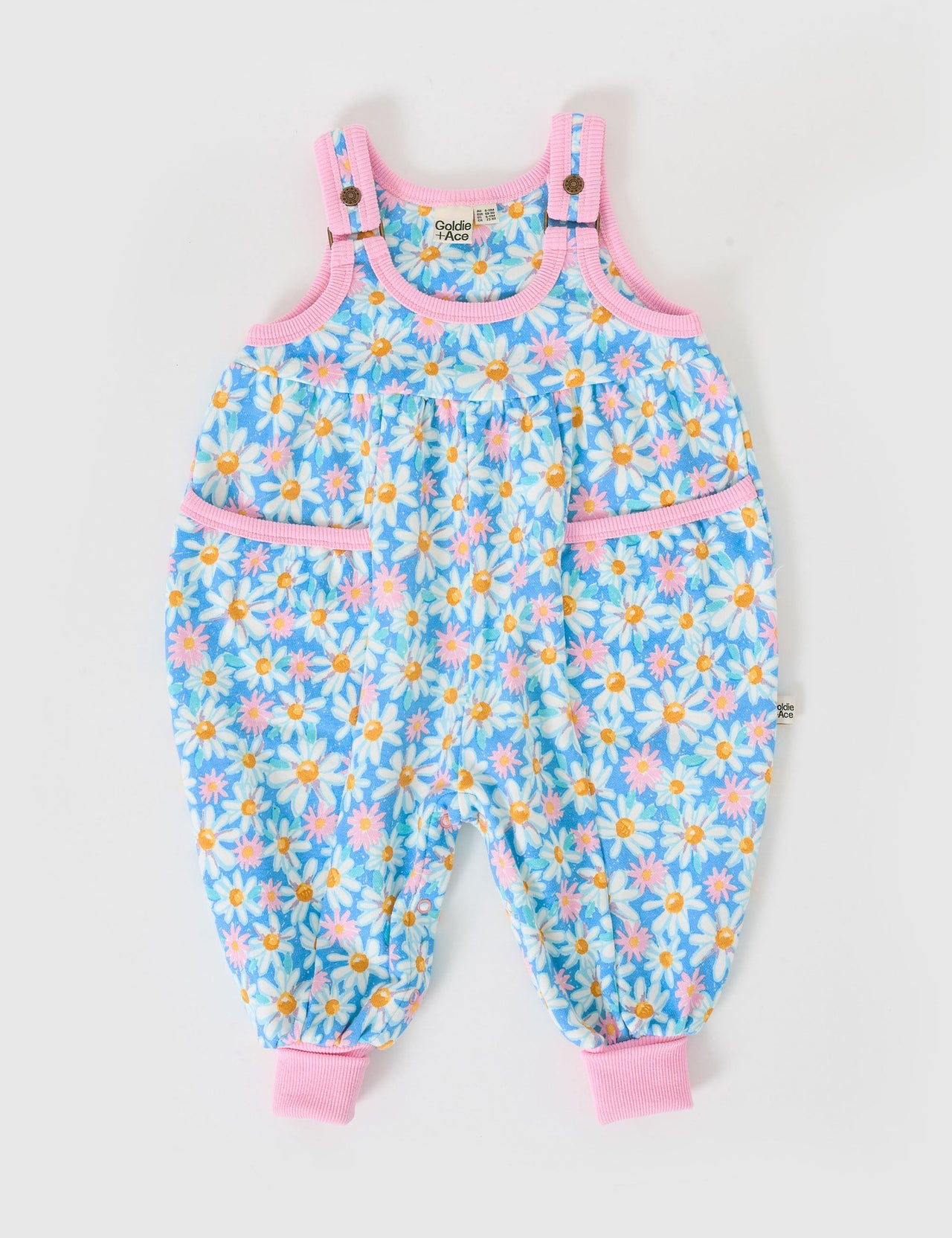 The Goldie + Ace Seaside Daisy Balloon Overall Romper in Seaside Daisy pictured on a grey background. The material is cotton terry. It is a overall made for babies, toddlers and kids.