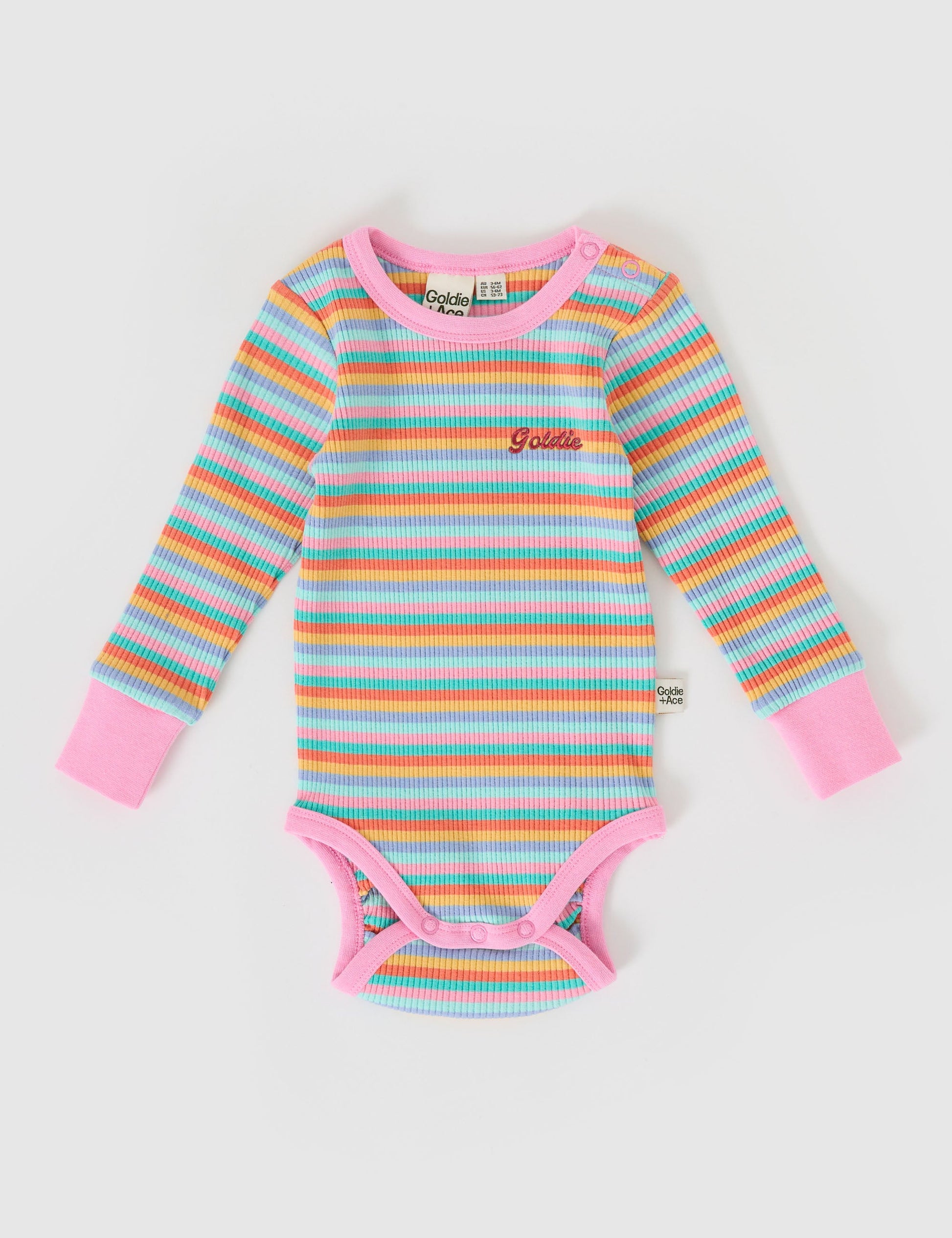 The Goldie + Ace Long Sleeve Rib Bodysuit in Candy Stripe pictured on a grey background. The material is soft ribbed cotton elastane. It is a babywear made for babies, toddlers and kids.