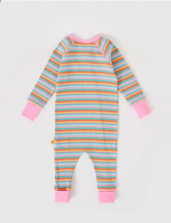 The Goldie + Ace Rib Zipsuit in Candy Stripe pictured on a grey background. The material is soft ribbed cotton elastane. It is a babywear made for babies, toddlers and kids.