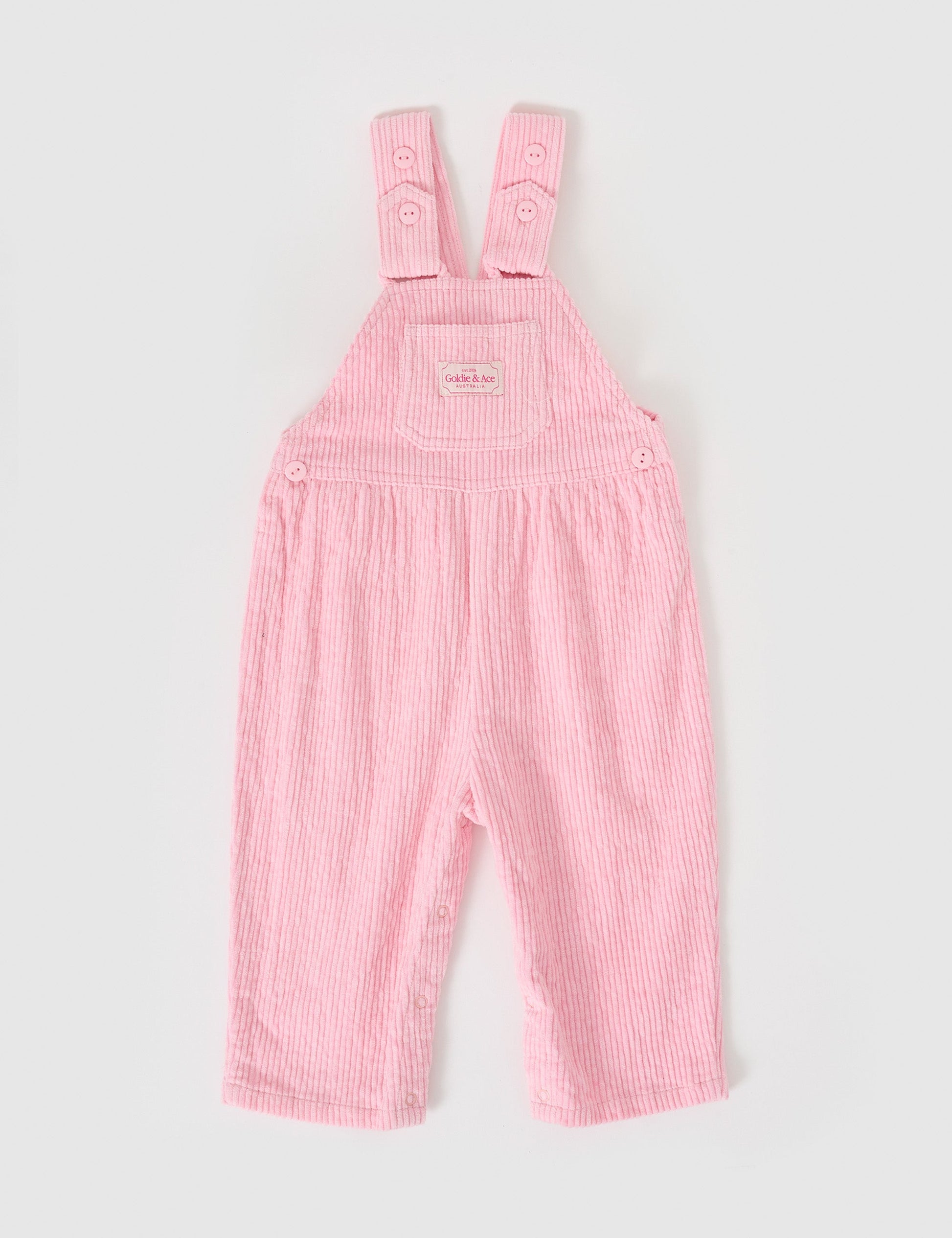 The Goldie + Ace Sammy Corduroy Overalls in Sweetpea pictured on a grey background. The material is cotton cord. It is a overall made for babies, toddlers and kids.