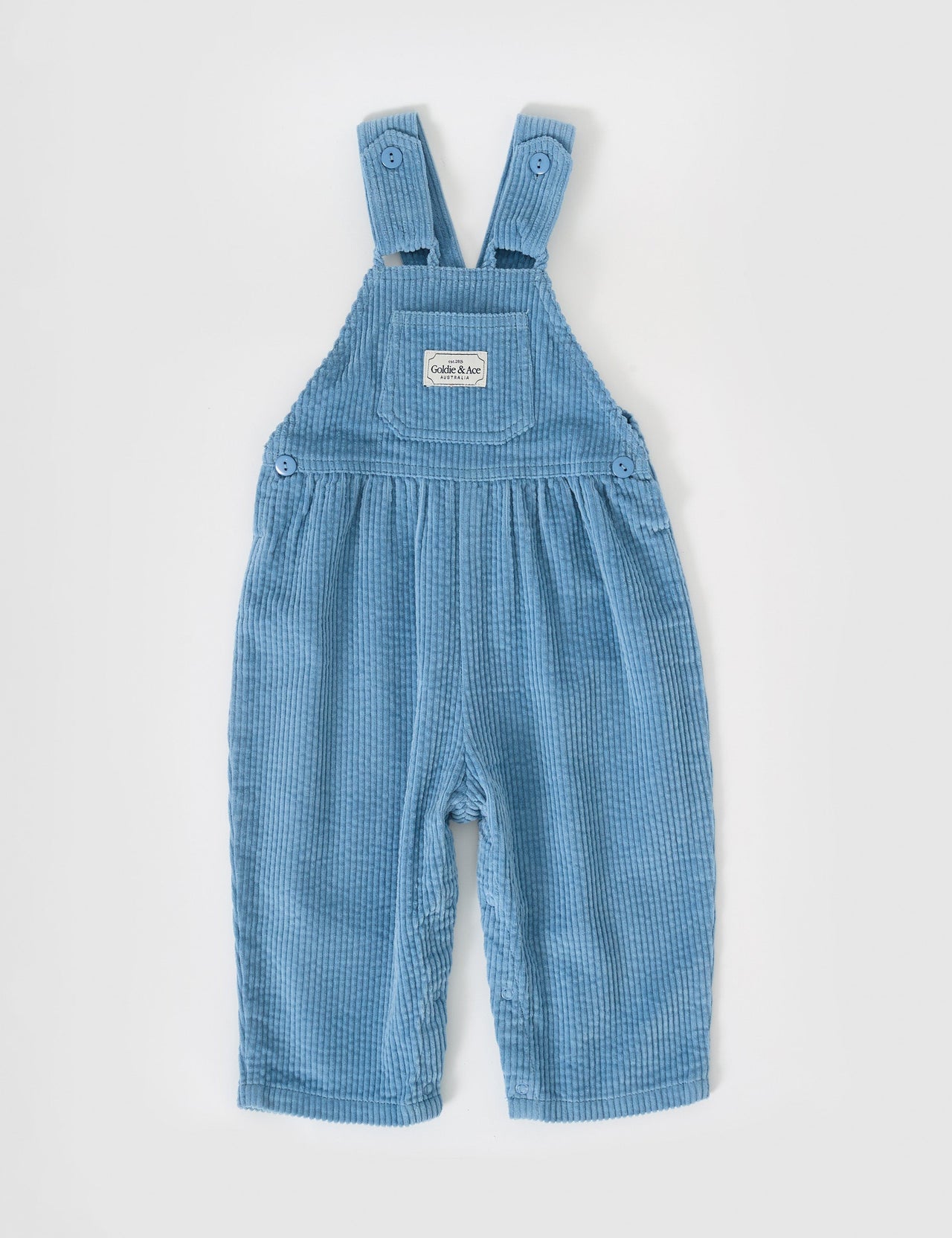 The Goldie + Ace Sammy Corduroy Overalls in Duck Egg pictured on a grey background. The material is cotton cord. It is a overall made for babies, toddlers and kids.