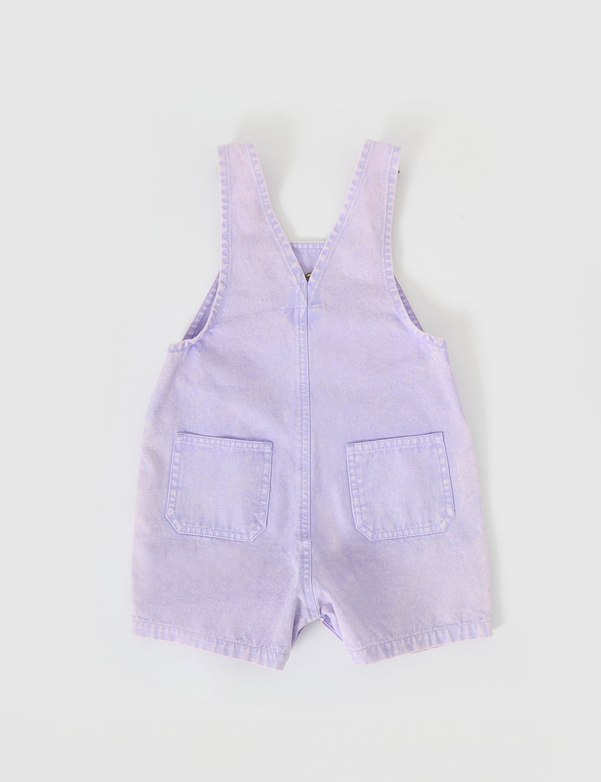 The Goldie + Ace Burton Vintage Washed Denim Overalls in Mauve pictured on a grey background. The material is cotton twill. It is a overall made for babies, toddlers and kids.