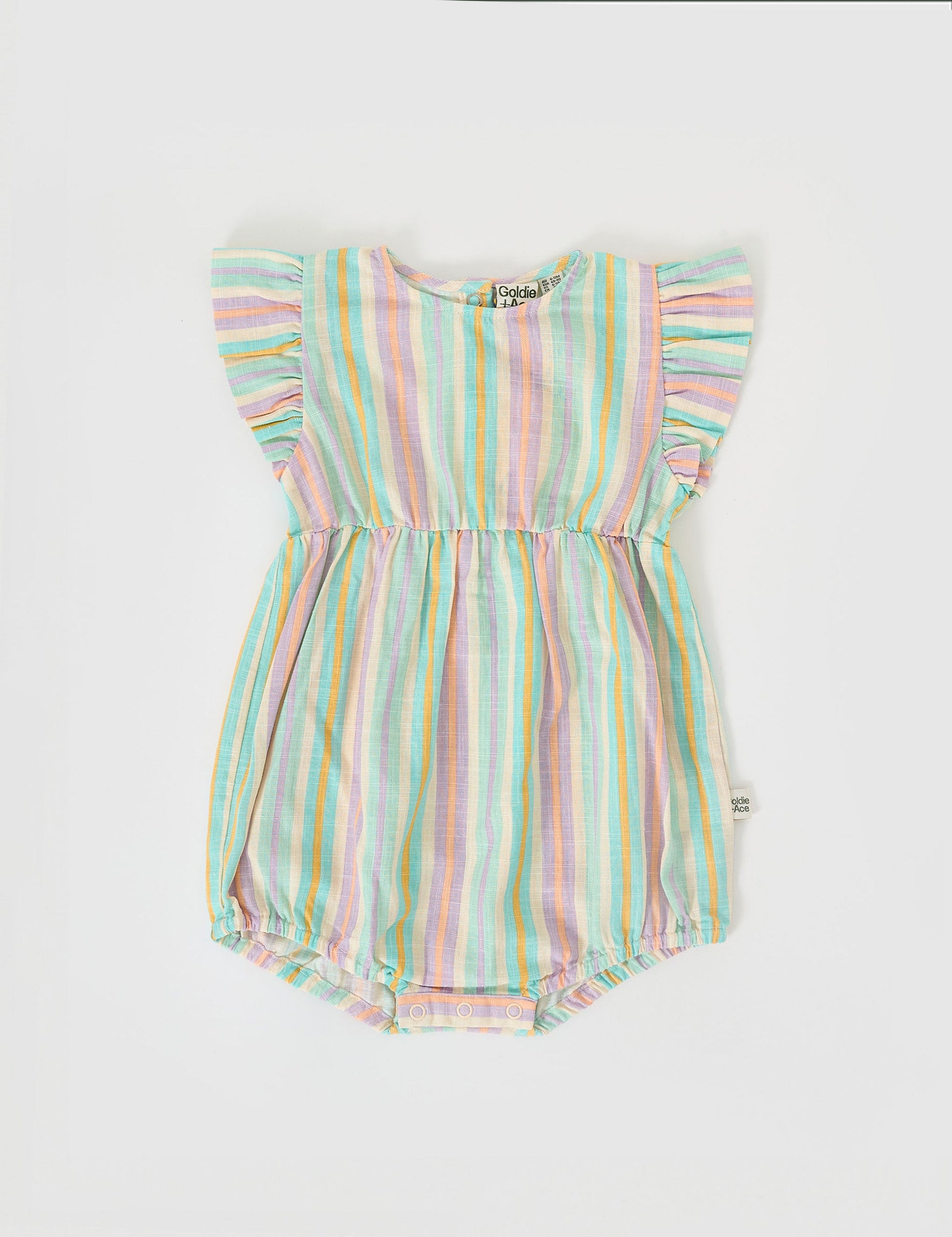 The Goldie + Ace Lani Linen Romper in Resort Stripe pictured on a grey background. The material is linen. It is a babywear made for babies, toddlers and kids.