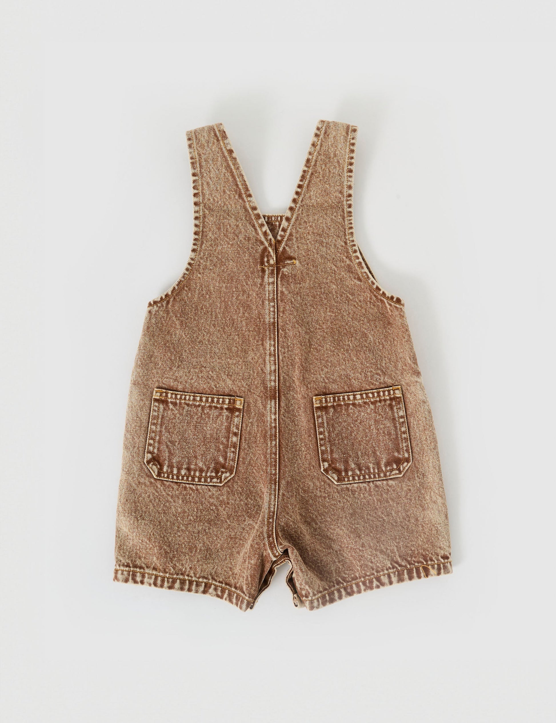 The Goldie + Ace Burton Vintage Washed Denim Overalls in Brown pictured on a grey background. The material is cotton denim. It is a overall made for babies, toddlers and kids.