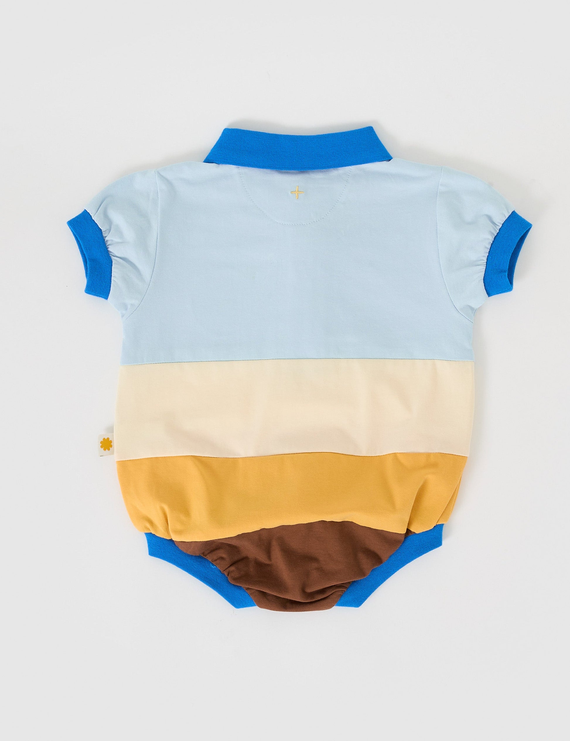 The Goldie + Ace Luca Polo Romper in Blue/Golden/Brown pictured on a grey background. The material is cotton jersey. It is a romper made for babies, toddlers and kids.