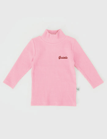 The Goldie + Ace Embroidered Rib Skivvy in Sweetpea pictured on a grey background. The material is soft ribbed cotton elastane. It is a top made for babies, toddlers and kids.