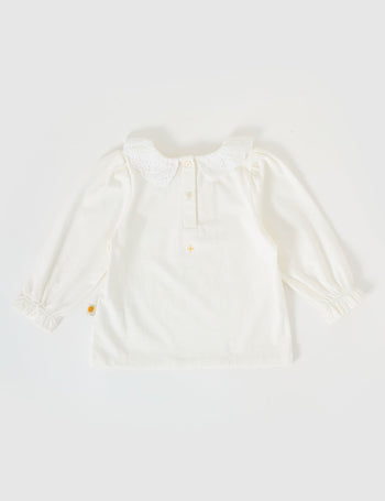 The Goldie + Ace Laura Puff Sleeve Collar Long Sleeve in White pictured on a grey background. The material is cotton jersey. It is a top made for babies, toddlers and kids.