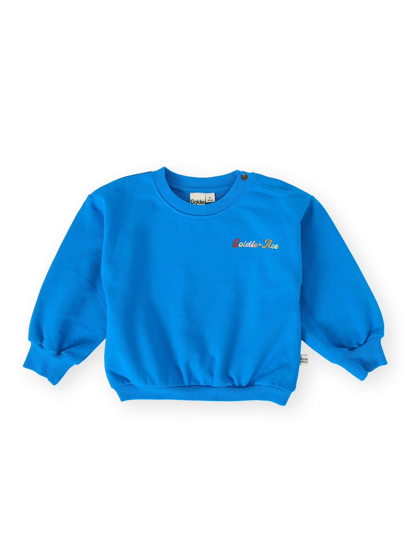 The Goldie + Ace Ellis Terry Sweater in Electric Blue pictured on a transparent background. The material is 100% cotton. It is a sweater made for babies, toddlers and kids.