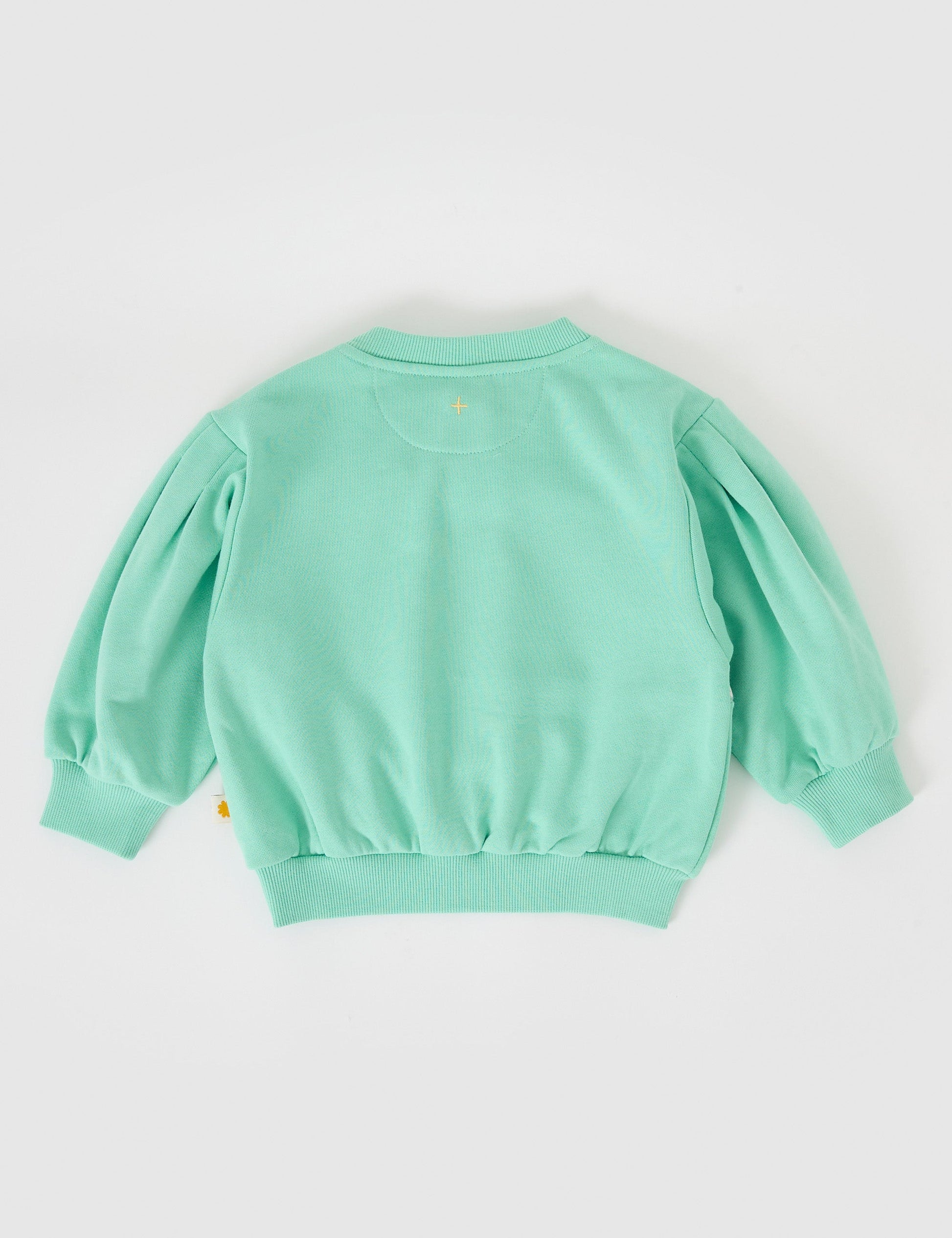 The Goldie + Ace Hazel Puff Sleeve Bunny Sweater in Mint pictured on a grey background. The material is cotton. It is a top made for babies, toddlers and kids.