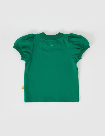 The Goldie + Ace Eden Embroidered Puff Sleeve T-Shirt in Bottle Green pictured on a grey background. The material is cotton jersey. It is a top made for babies, toddlers and kids.