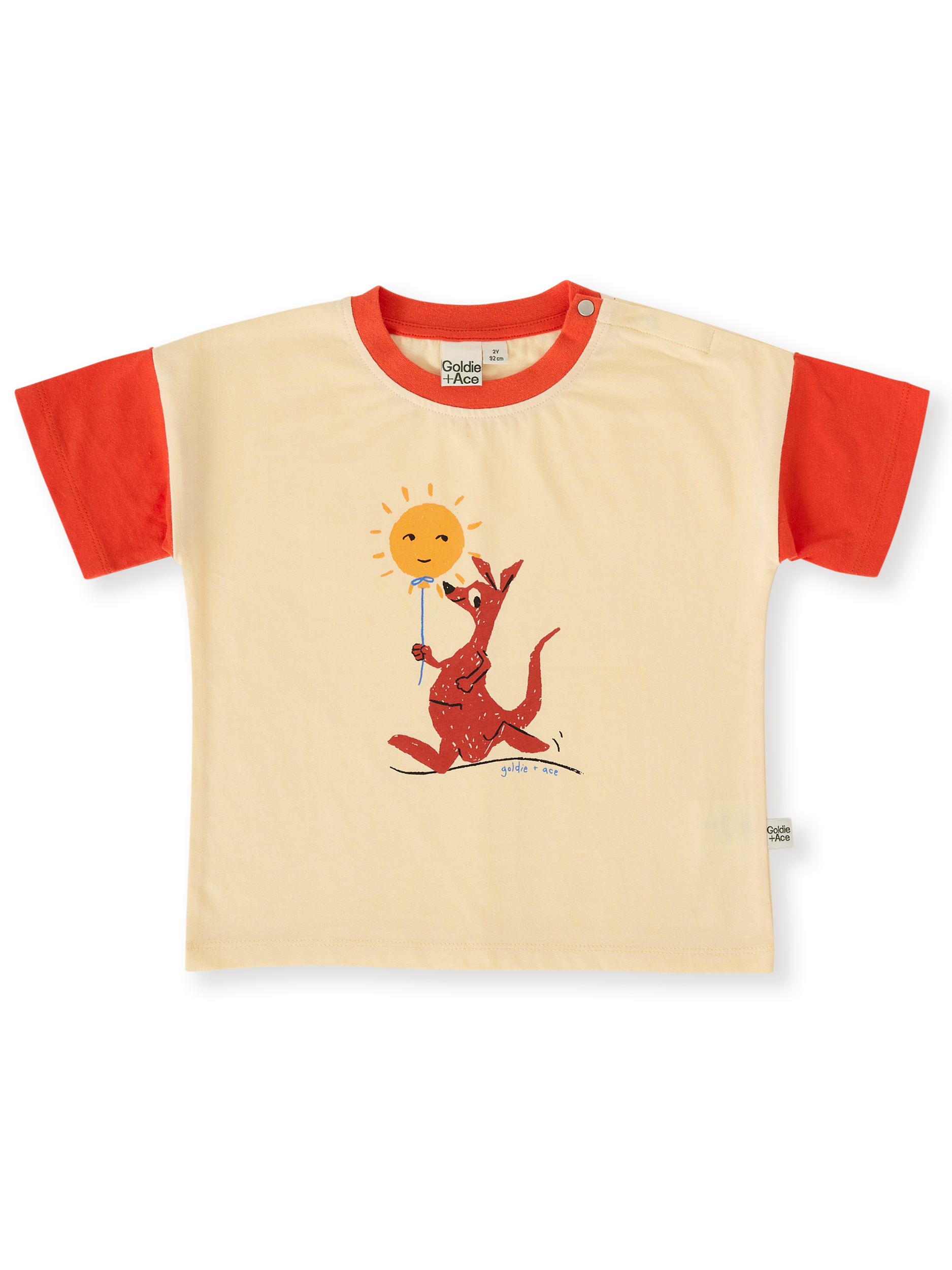 The Goldie + Ace Hop Skip Jump T-Shirt in Vanilla/Apple Red pictured on a transparent background. The material is 100% cotton. It is a top made for babies, toddlers and kids.