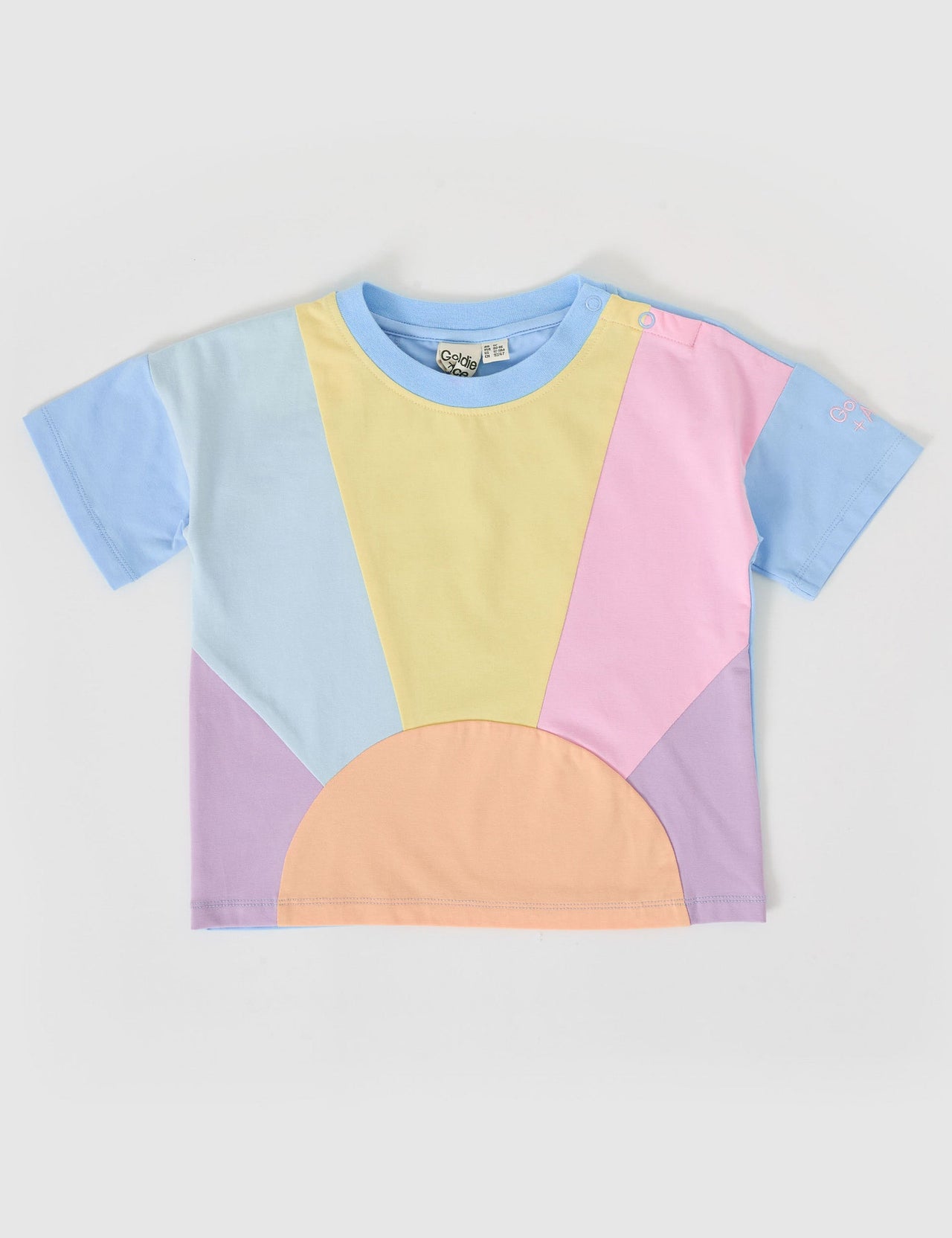 The Goldie + Ace Byron T-Shirt in Pastel Multi pictured on a grey background. The material is cotton jersey. It is a top made for babies, toddlers and kids.