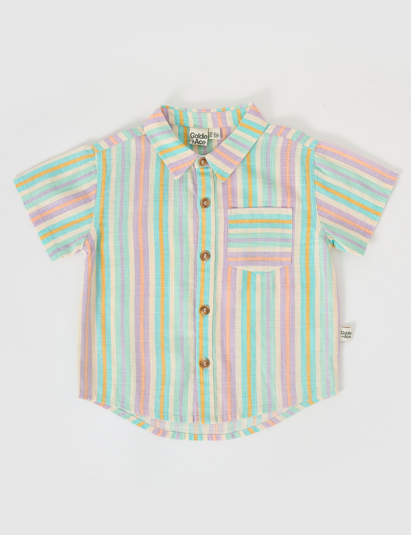 The Goldie + Ace Holiday Linen Shirt in Resort Stripe pictured on a grey background. The material is linen. It is a top made for babies, toddlers and kids.