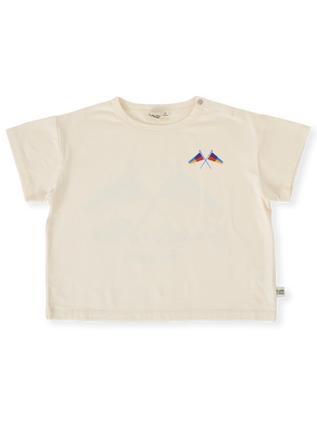 The Goldie + Ace Nautical Flag Oversized T-Shirt in Cream pictured on a transparent background. The material is 100% cotton. It is a top made for babies, toddlers and kids.