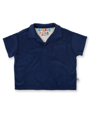 The Goldie + Ace Oversized Terry Polo in Navy pictured on a transparent background. The material is 100% cotton. It is a top made for babies, toddlers and kids.