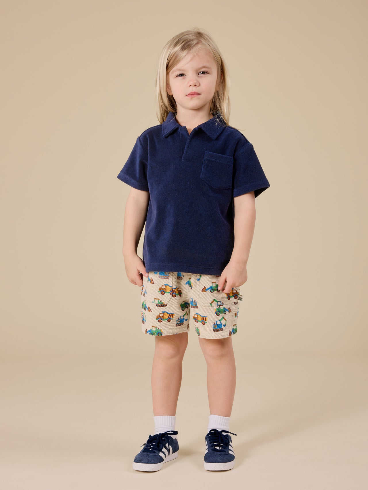 The Goldie + Ace Diggers Noah Shorts in Sand pictured on a transparent background. The material is durable & soft cotton-linen blend. It is a bottom made for babies, toddlers and kids.