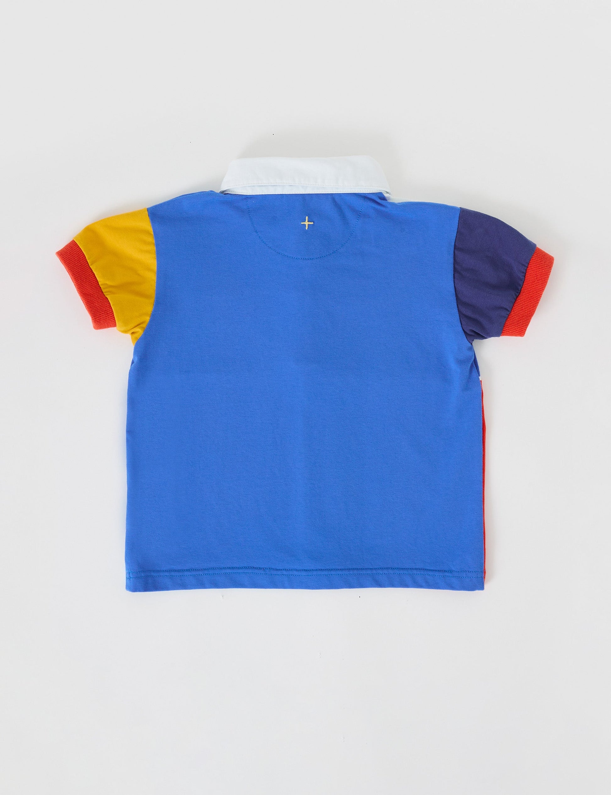 The Goldie + Ace Myles Colour Block Polo Shirt in Primary Multi pictured on a grey background. The material is cotton jersey. It is a top made for babies, toddlers and kids.