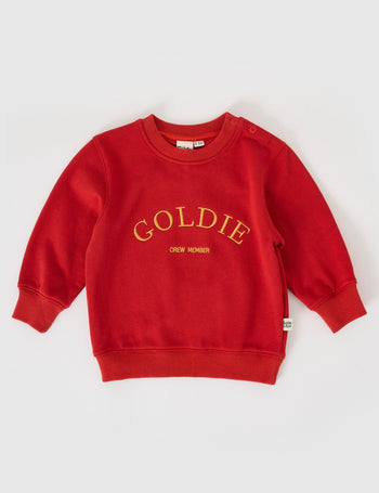 The Goldie + Ace Goldie Crew Embroidered Sweater in Red pictured on a grey background. The material is cotton terry. It is a top made for babies, toddlers and kids.