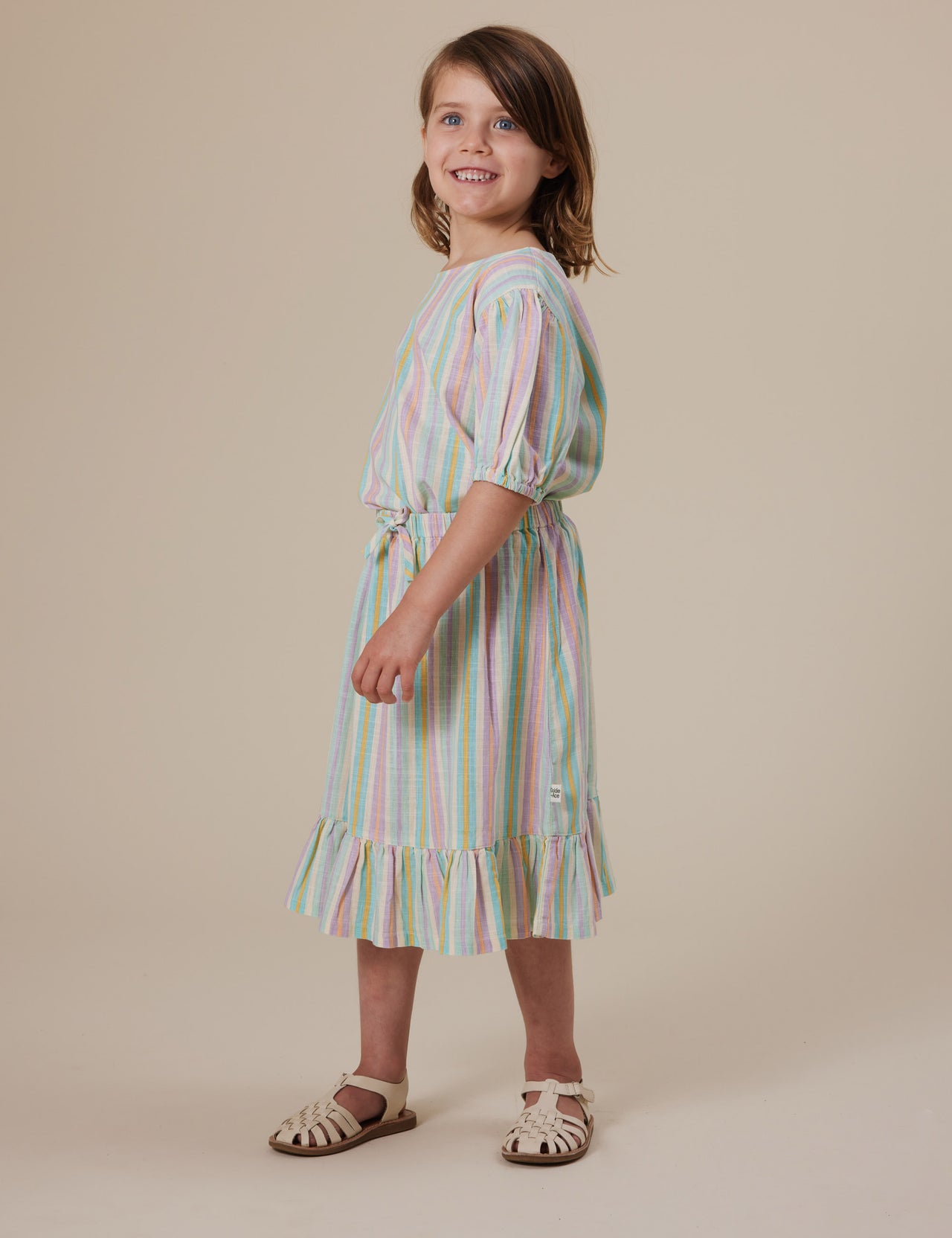 The Goldie + Ace Lior Linen Skirt in Resort Stripe pictured on a grey background. The material is linen. It is a bottom made for babies, toddlers and kids.