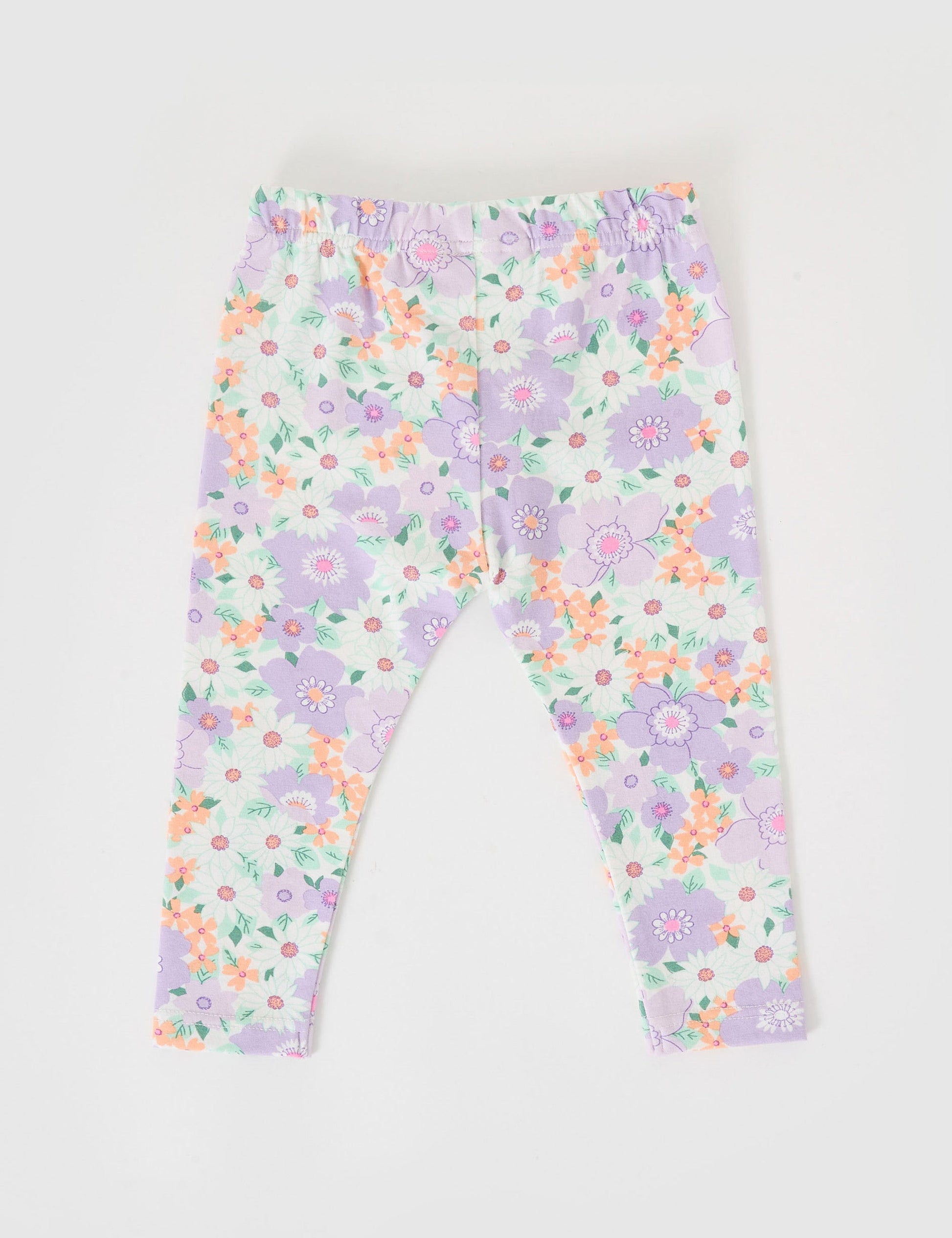 The Goldie + Ace Flora Leggings in Lilac Multi pictured on a grey background. The material is soft cotton elastane. It is a bottom made for babies, toddlers and kids.