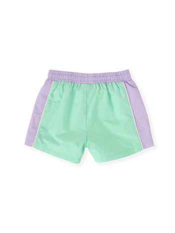 The Goldie + Ace Retro Sporty Shorts in Peapod/Lilac pictured on a transparent background. The material is poly with cotton lining. It is a bottom made for babies, toddlers and kids.