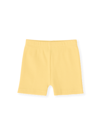 The Goldie + Ace Lara Rib Shorties in Lemon pictured on a transparent background. The material is soft cotton elastane. It is a bottom made for babies, toddlers and kids.