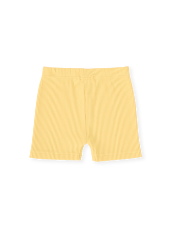 The Goldie + Ace Lara Rib Shorties in Lemon pictured on a transparent background. The material is soft cotton elastane. It is a bottom made for babies, toddlers and kids.