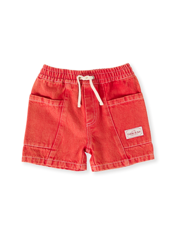 The Goldie + Ace Noah Denim Pocket Shorts in Apple Red pictured on a transparent background. The material is 100% cotton. It is a bottom made for babies, toddlers and kids.