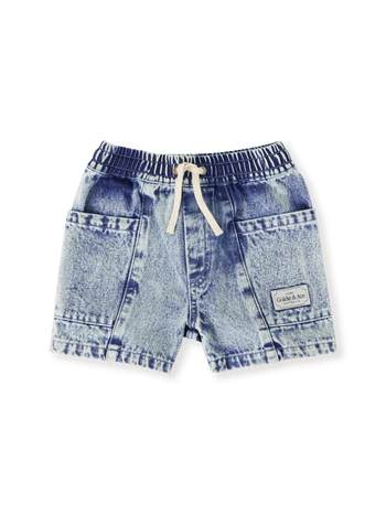 The Goldie + Ace Noah Denim Pocket Shorts in Light Denim pictured on a transparent background. The material is 100% cotton. It is a bottom made for babies, toddlers and kids.