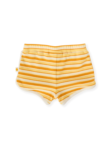 The Goldie + Ace Sunshine Stripe Shorts in Lemon/Golden pictured on a transparent background. The material is 100% cotton. It is a bottom made for babies, toddlers and kids.