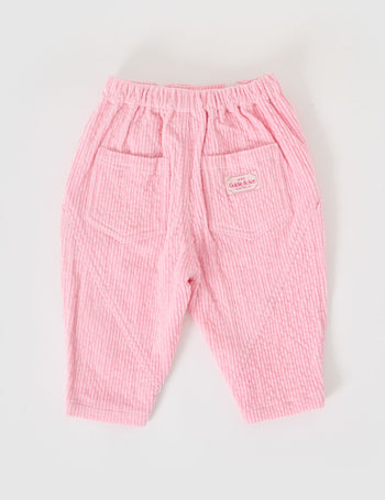 The Goldie + Ace Nora Corduroy Pant in Sweetpea pictured on a grey background. The material is cotton cord. It is a bottom made for babies, toddlers and kids.