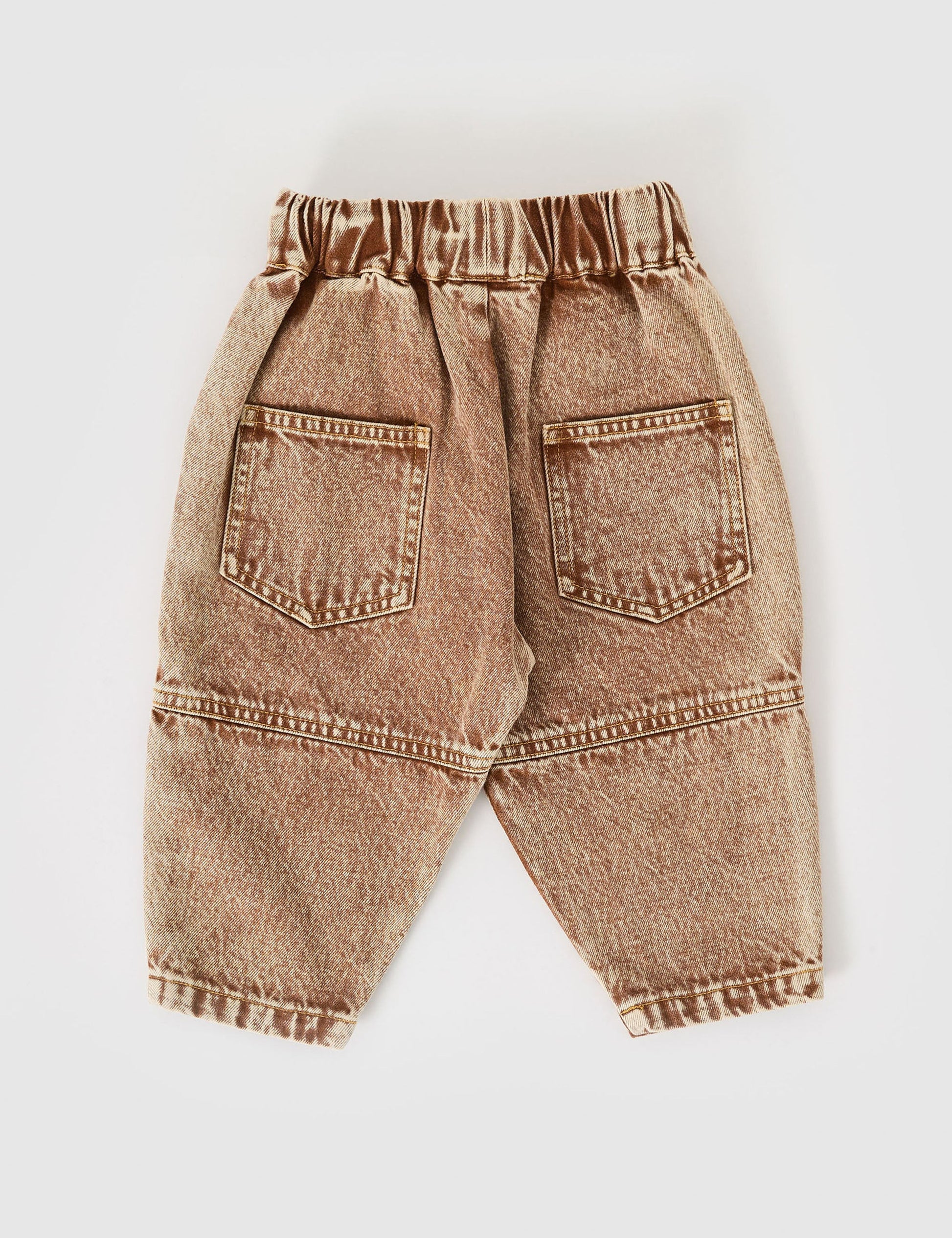 The Goldie + Ace Drew Denim Pocket Pant in Brown pictured on a grey background. The material is cotton denim. It is a bottom made for babies, toddlers and kids.