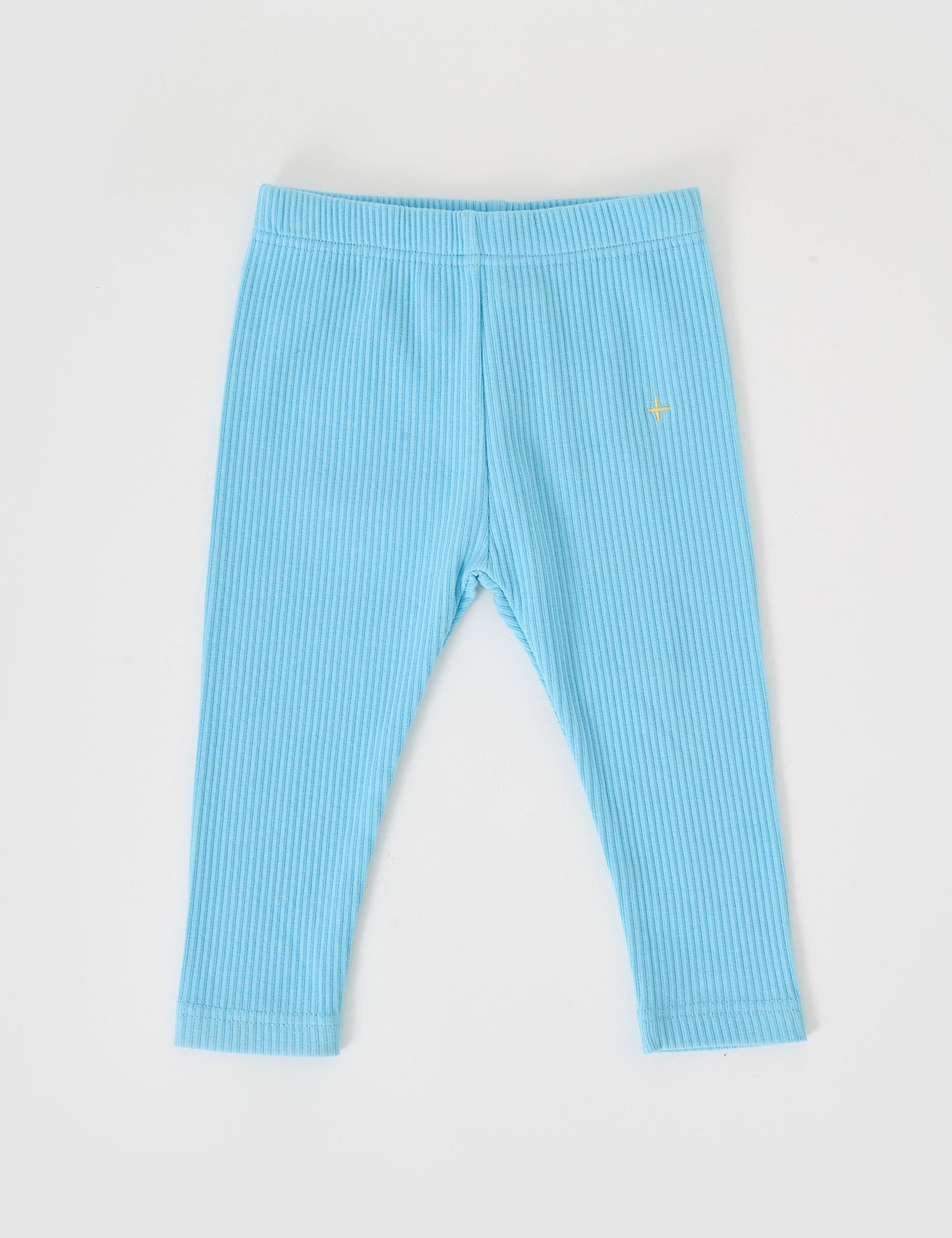 The Goldie + Ace Bowie Rib Legging in Sky Blue pictured on a grey background. The material is soft cotton elastane. It is a bottom made for babies, toddlers and kids.