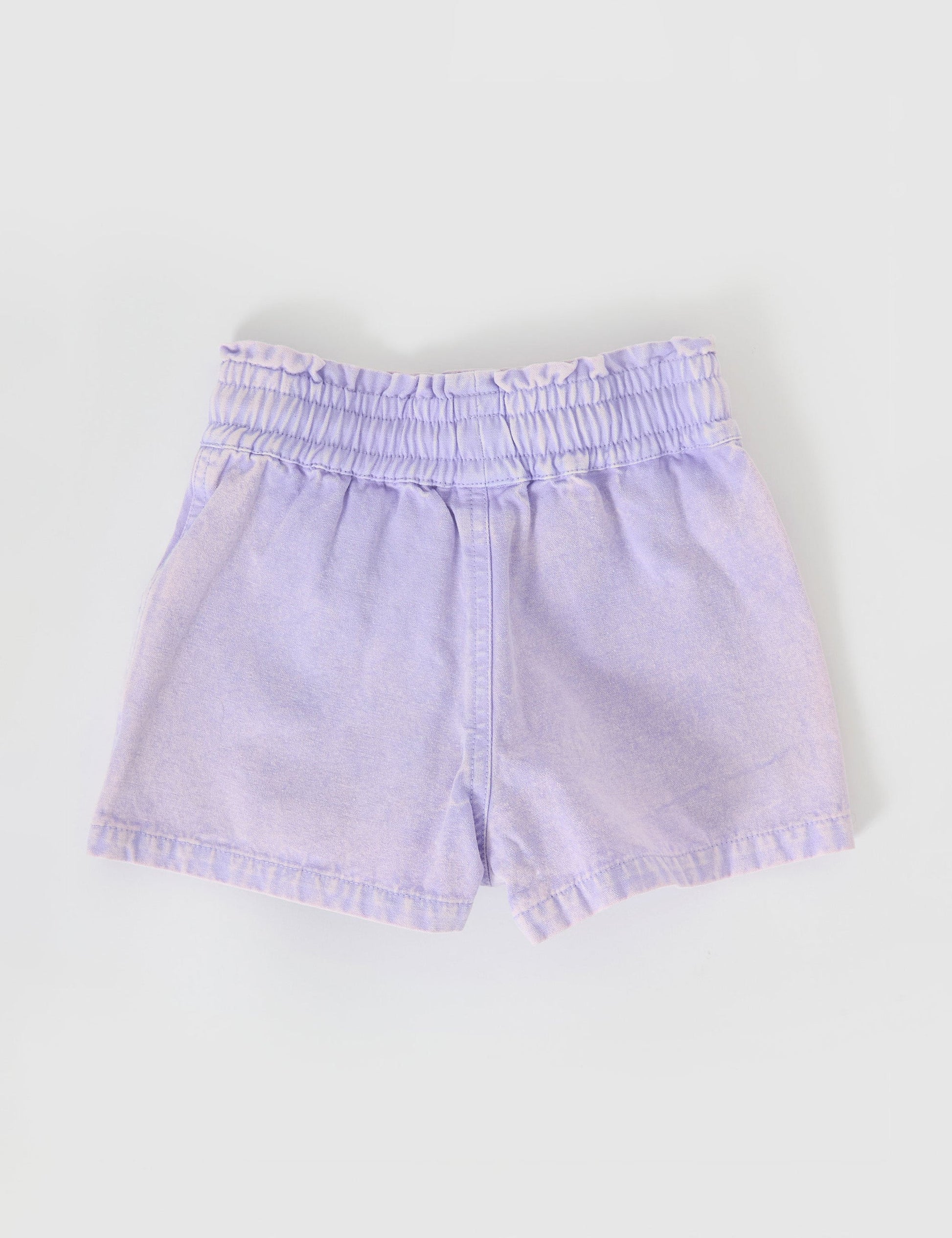 The Goldie + Ace Ziggy Denim Shorts in Mauve pictured on a grey background. The material is cotton twill. It is a bottom made for babies, toddlers and kids.