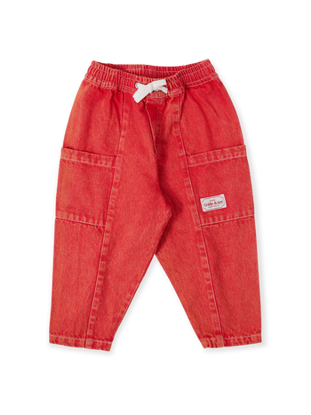 The Goldie + Ace Kit Denim Pocket Pant in Apple Red pictured on a transparent background. The material is 100% cotton. It is a bottom made for babies, toddlers and kids.