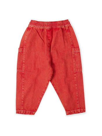 The Goldie + Ace Kit Denim Pocket Pant in Apple Red pictured on a transparent background. The material is 100% cotton. It is a bottom made for babies, toddlers and kids.