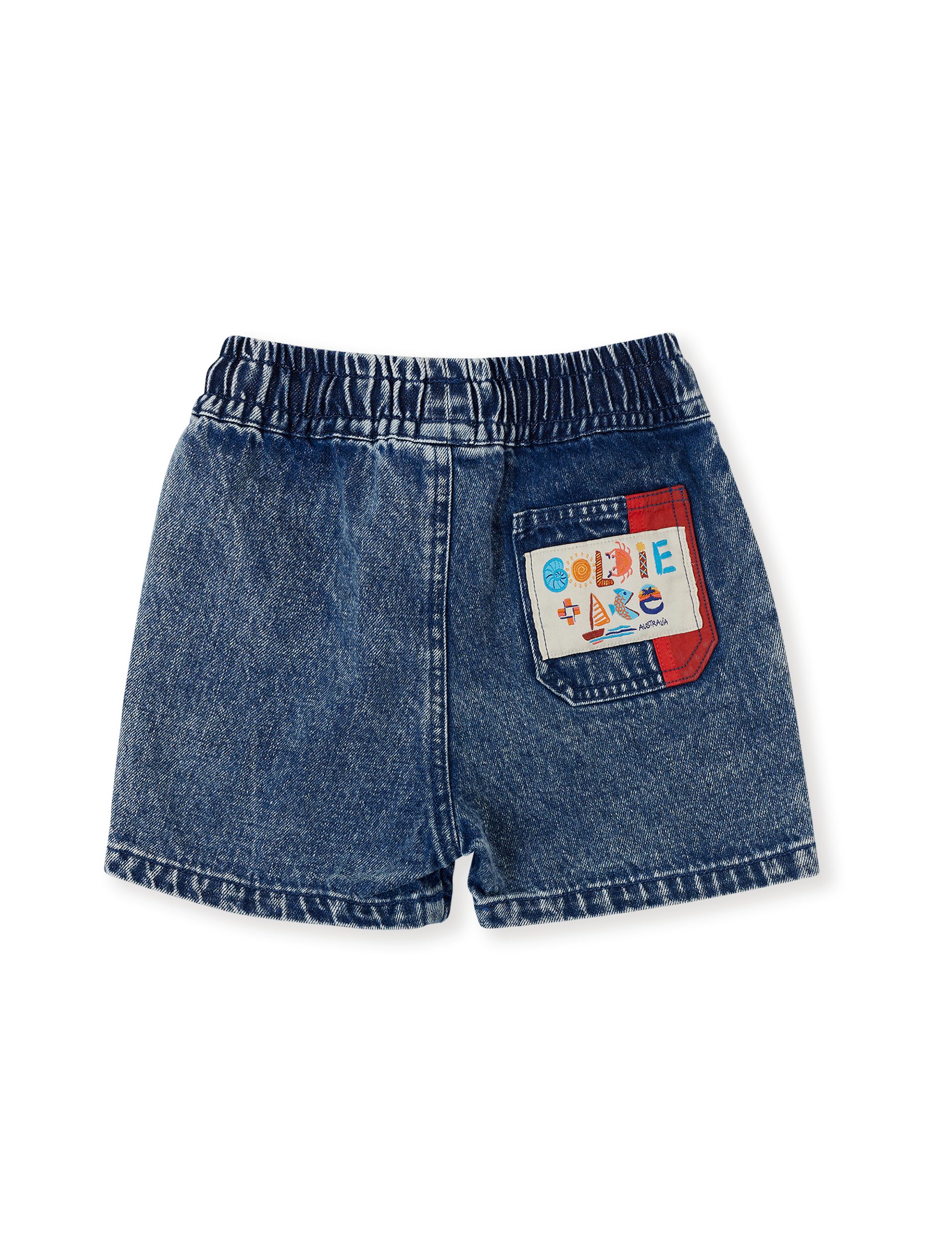 The Goldie + Ace Primary Pop Noah Denim Shorts in Dark Denim pictured on a transparent background. The material is 100% cotton. It is a bottom made for babies, toddlers and kids.